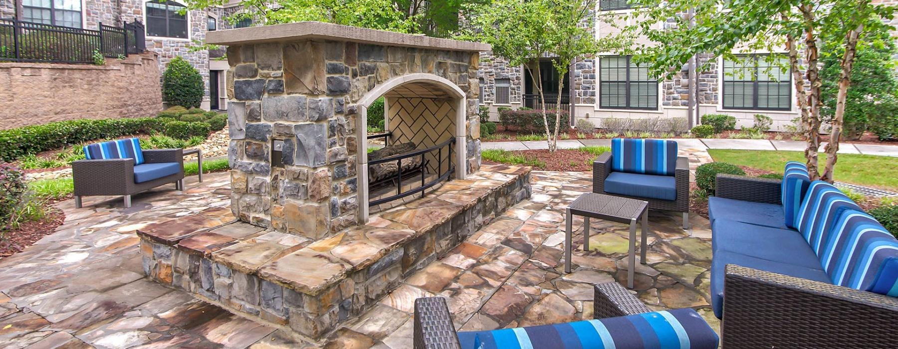a brick fireplace in a backyard
