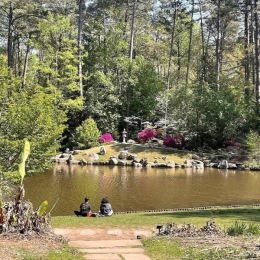 A beautiful community at the heart of all your passions people sitting by a pond
