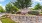 a sign on a stone wall