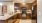 a kitchen with dark wood cabinets