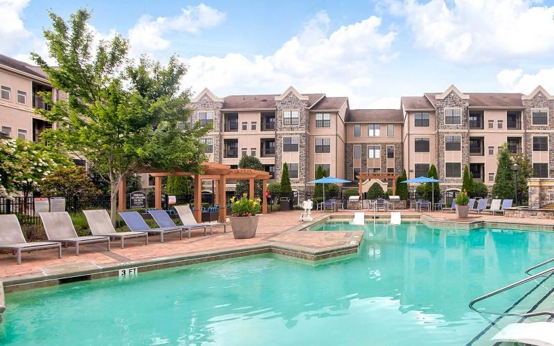 a pool in front of a building